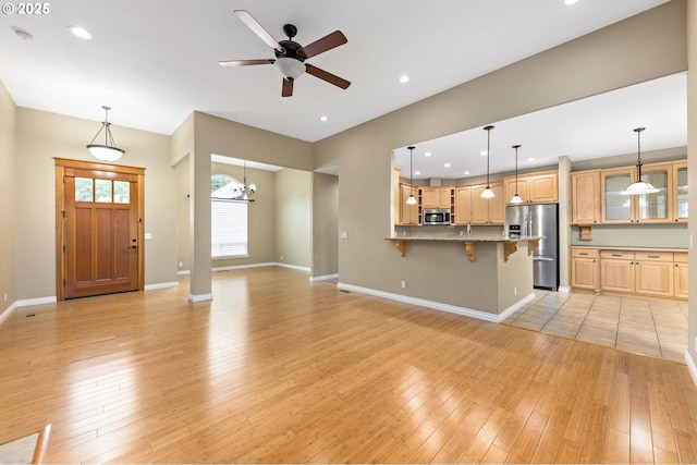 115 Duane Ct, Myrtle Creek, OR 97457 - unfurnished living room with light wood finished floors, baseboards, ceiling fan, and recessed lighting