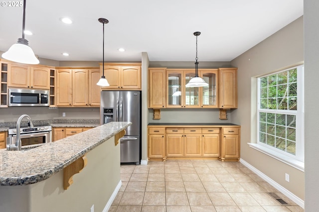 115 Duane Ct, Myrtle Creek, OR 97457 - kitchen with appliances with stainless steel finishes, light brown cabinets, glass insert cabinets, light stone countertops, and recessed lighting