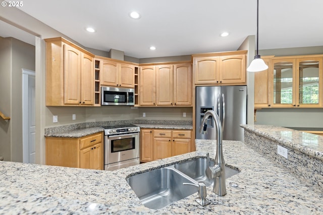 115 Duane Ct, Myrtle Creek, OR 97457 - kitchen featuring appliances with stainless steel finishes, a sink, recessed lighting, light stone counters, and pendant lighting