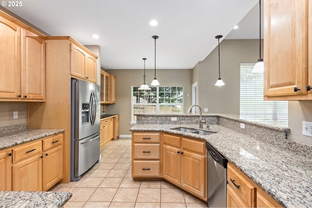 115 Duane Ct, Myrtle Creek, OR 97457 - kitchen with stainless steel appliances, a sink, light tile patterned floors, light brown cabinetry, and light stone countertops