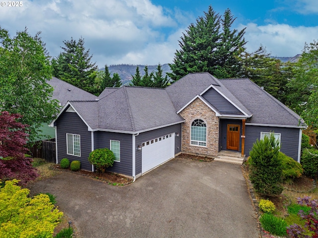 115 Duane Ct, Myrtle Creek, OR 97457 - view of front of property featuring an attached garage, stone siding, driveway, fence, and a shingled roof