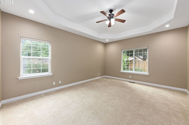 115 Duane Ct, Myrtle Creek, OR 97457 - carpeted empty room featuring healthy amount of natural light, baseboards, a ceiling fan, a tray ceiling, and recessed lighting
