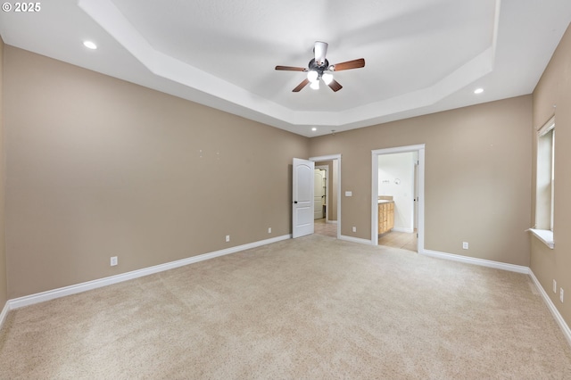 115 Duane Ct, Myrtle Creek, OR 97457 - unfurnished bedroom with a tray ceiling, light carpet, recessed lighting, baseboards, and ensuite bath