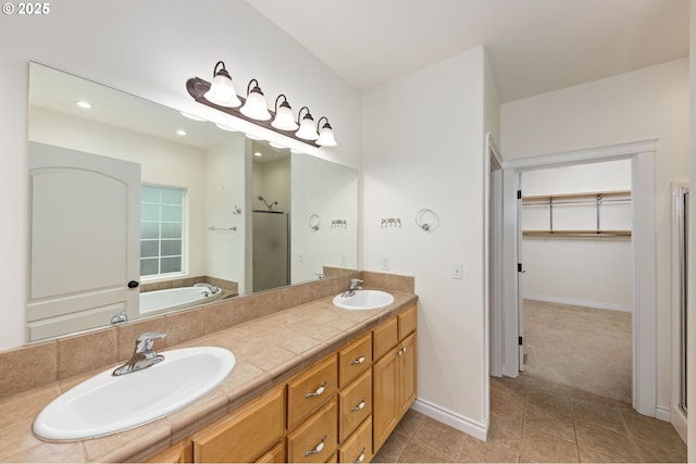115 Duane Ct, Myrtle Creek, OR 97457 - bathroom with a shower stall, tile patterned floors, double vanity, recessed lighting, and a walk in closet