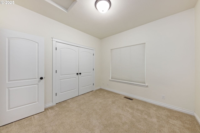 115 Duane Ct, Myrtle Creek, OR 97457 - unfurnished bedroom with carpet floors, baseboards, attic access, and a closet