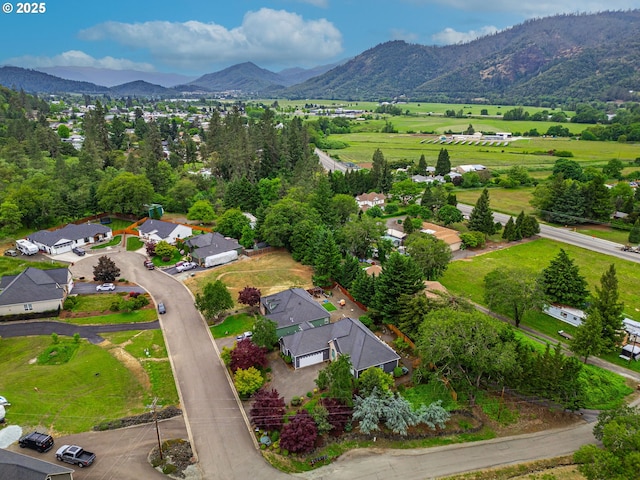 115 Duane Ct, Myrtle Creek, OR 97457 - aerial overview of property's location featuring a mountain backdrop and nearby suburban area