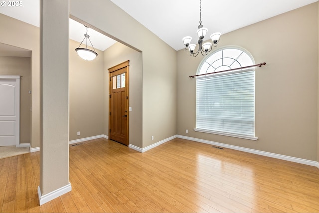115 Duane Ct, Myrtle Creek, OR 97457 - entrance foyer with light wood finished floors, a chandelier, and baseboards
