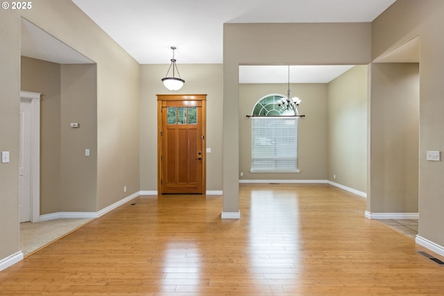 115 Duane Ct, Myrtle Creek, OR 97457 - entryway featuring light wood-style flooring, a chandelier, and baseboards