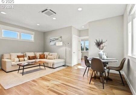 living room with hardwood / wood-style floors and a wealth of natural light