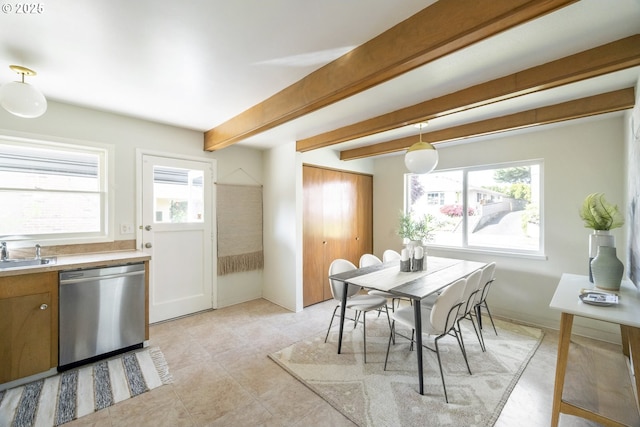 dining area featuring plenty of natural light, beamed ceiling, and light tile patterned floors