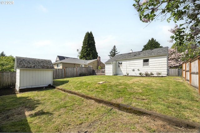 view of yard with a storage unit and an outbuilding