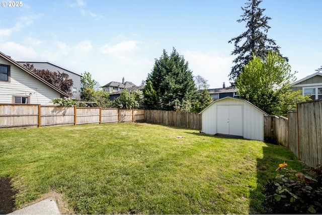 view of yard featuring a shed and an outbuilding