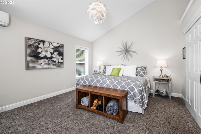 bedroom with dark colored carpet, lofted ceiling, baseboards, a closet, and a wall unit AC