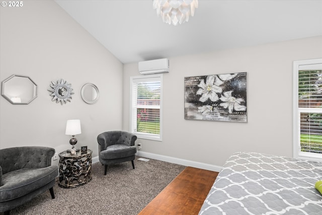 carpeted bedroom with an AC wall unit, baseboards, and lofted ceiling
