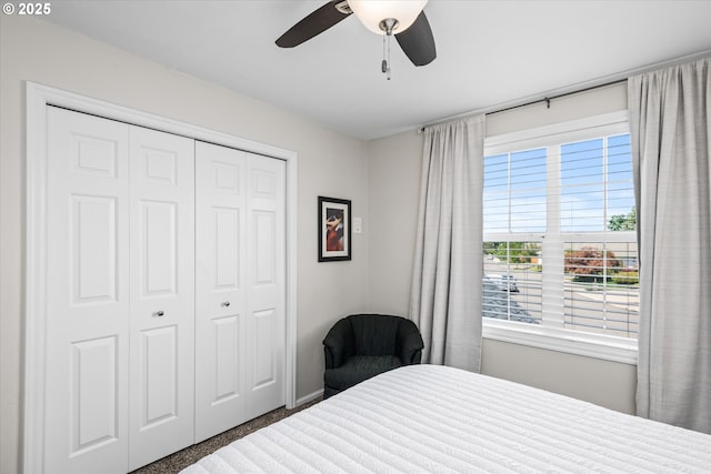 bedroom featuring a closet, baseboards, and a ceiling fan