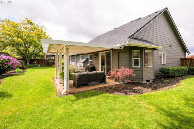 rear view of house with a patio, an outdoor hangout area, and roof with shingles
