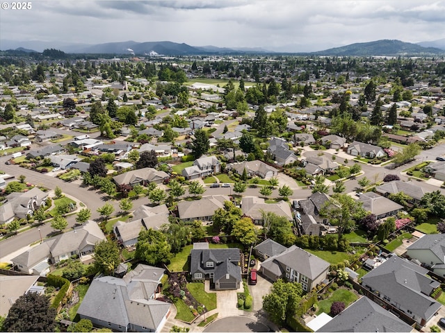 aerial perspective of suburban area featuring a mountainous background