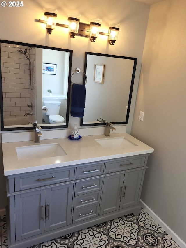23538 NW Saint Helens Rd Unit S5, Portland, OR 97231 - bathroom with toilet, double vanity, baseboards, and tile patterned floors