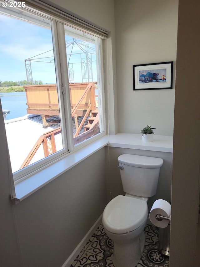 23538 NW Saint Helens Rd Unit S5, Portland, OR 97231 - bathroom with toilet, baseboards, and tile patterned floors