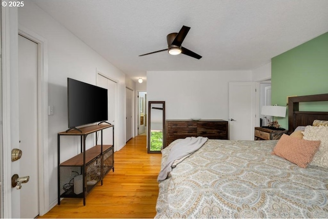 bedroom featuring light wood finished floors and ceiling fan