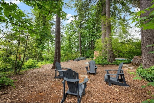 view of property's community with an outdoor fire pit
