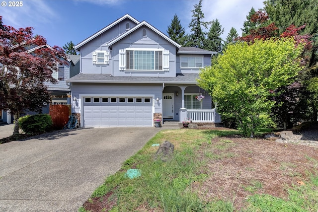 14818 NE 23rd Ave, Vancouver, WA 98686 - traditional-style home featuring asphalt driveway, a porch, a garage, and stone siding