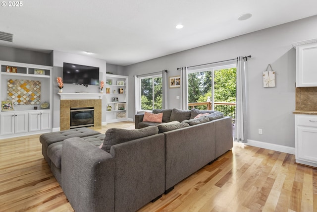 14818 NE 23rd Ave, Vancouver, WA 98686 - living area featuring a fireplace, light wood-type flooring, recessed lighting, and built in shelves