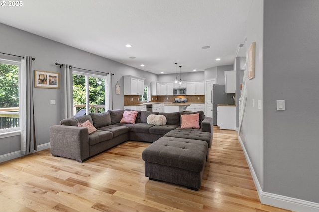 14818 NE 23rd Ave, Vancouver, WA 98686 - living area with light wood finished floors and recessed lighting