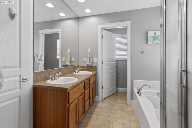 14818 NE 23rd Ave, Vancouver, WA 98686 - full bath featuring double vanity, a garden tub, and recessed lighting