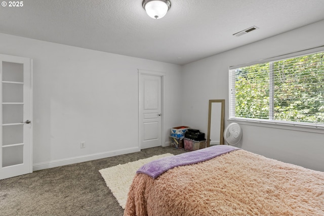 14818 NE 23rd Ave, Vancouver, WA 98686 - carpeted bedroom with a textured ceiling and baseboards