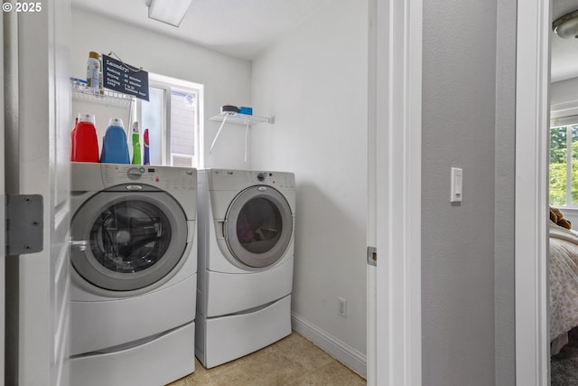 14818 NE 23rd Ave, Vancouver, WA 98686 - laundry area featuring washing machine and clothes dryer and light tile patterned floors