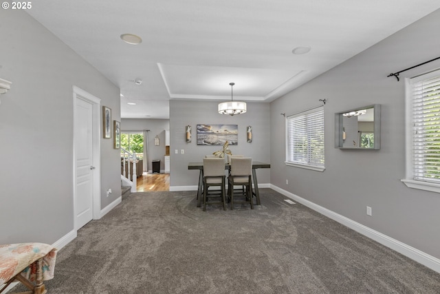 14818 NE 23rd Ave, Vancouver, WA 98686 - carpeted dining room with healthy amount of natural light, a chandelier, and a raised ceiling