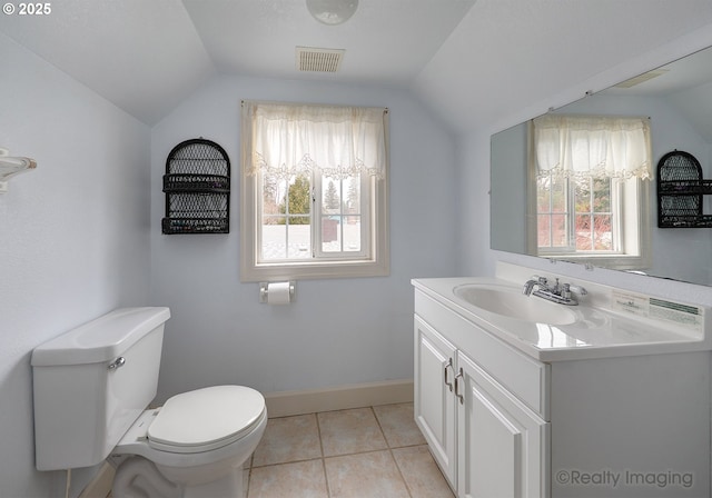 bathroom featuring visible vents, toilet, lofted ceiling, tile patterned floors, and vanity