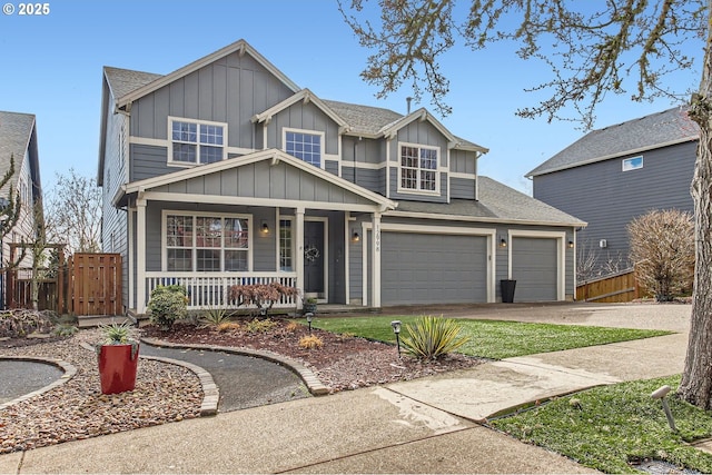 view of front of house featuring covered porch, fence, board and batten siding, and concrete driveway