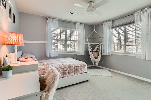12998 SW Kostel Ln, Portland, OR 97224 - bedroom with multiple windows, carpet, and baseboards