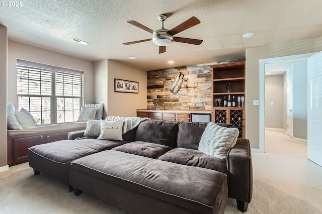 12998 SW Kostel Ln, Portland, OR 97224 - living area with light colored carpet, ceiling fan, a textured ceiling, recessed lighting, and baseboards