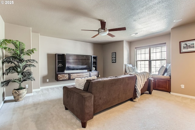 12998 SW Kostel Ln, Portland, OR 97224 - living room featuring light colored carpet, ceiling fan, baseboards, and a textured ceiling