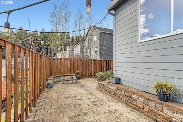 12998 SW Kostel Ln, Portland, OR 97224 - fenced backyard featuring an outdoor fire pit and a patio