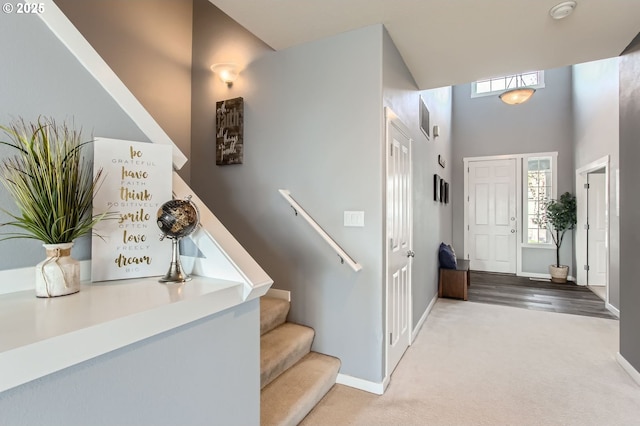 12998 SW Kostel Ln, Portland, OR 97224 - carpeted foyer entrance featuring healthy amount of natural light, baseboards, stairs, and a high ceiling