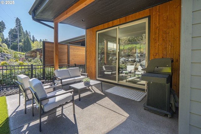 view of patio featuring fence, an outdoor hangout area, and area for grilling