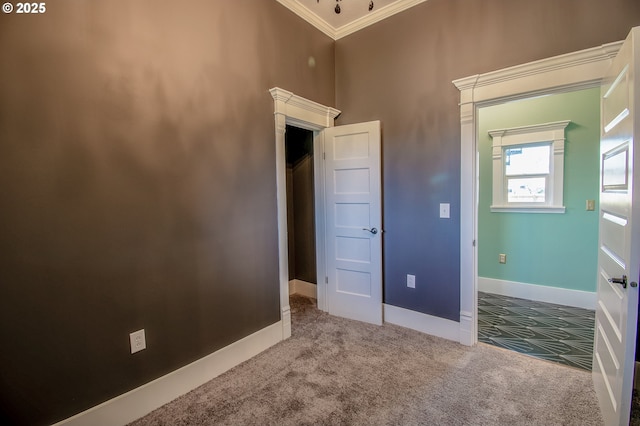 unfurnished bedroom with carpet floors and ornamental molding