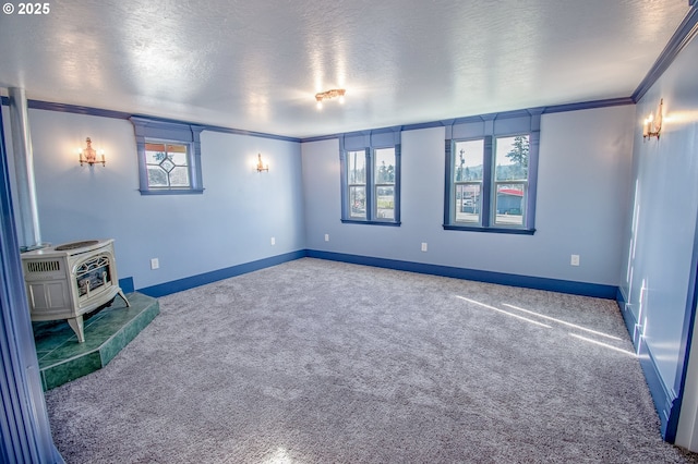 interior space with a wood stove, a healthy amount of sunlight, and crown molding