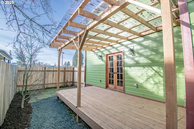 deck featuring french doors and a pergola