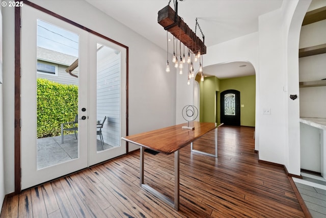 6035 NE 9th Ave, Portland, OR 97211 - dining area featuring arched walkways and hardwood / wood-style flooring