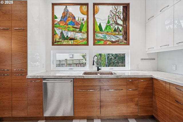 6035 NE 9th Ave, Portland, OR 97211 - kitchen featuring stainless steel dishwasher, brown cabinets, modern cabinets, and light stone countertops