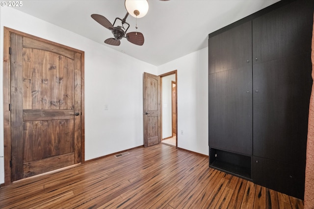 6035 NE 9th Ave, Portland, OR 97211 - unfurnished bedroom featuring wood finished floors, a closet, and a ceiling fan