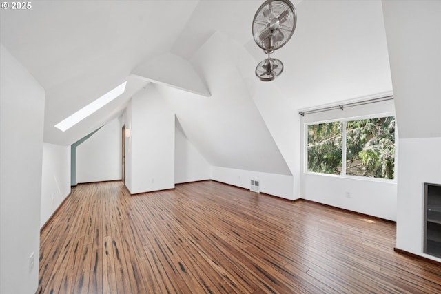 6035 NE 9th Ave, Portland, OR 97211 - additional living space featuring vaulted ceiling, a skylight, and hardwood / wood-style floors