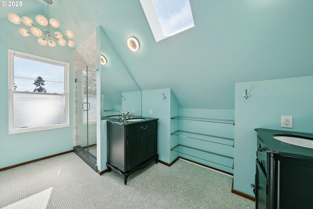 6035 NE 9th Ave, Portland, OR 97211 - bathroom with two vanities, a shower stall, lofted ceiling, and a skylight