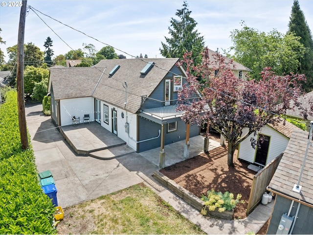 6035 NE 9th Ave, Portland, OR 97211 - view of front of property featuring a patio and roof with shingles