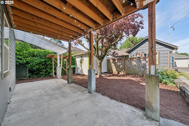 6035 NE 9th Ave, Portland, OR 97211 - view of patio featuring an outbuilding and a pergola